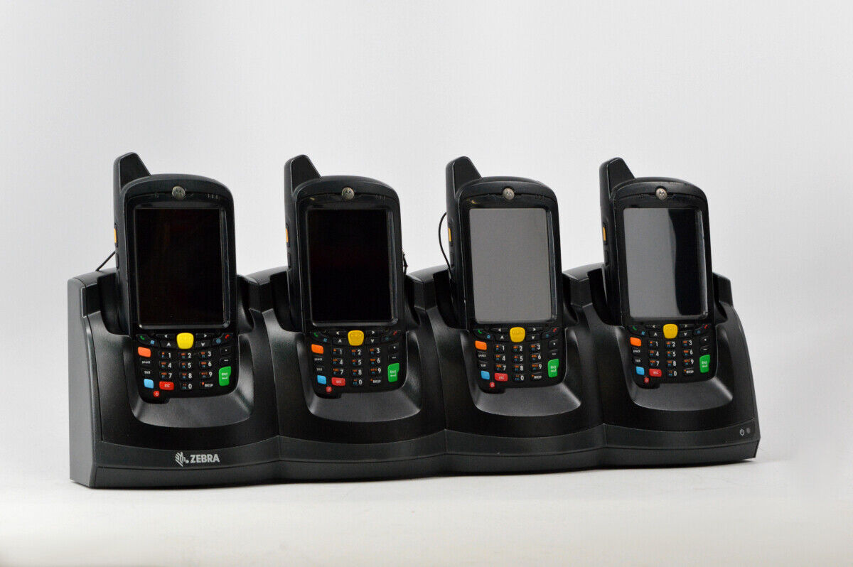 Four Motorola MC67ND-PD0BAF00501 Handheld Computers With 4-Slot Charging Cradle