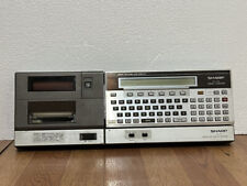 Vintage Sharp PC-1501 Pocket Computer with CE-150 Printer cassette interface picture