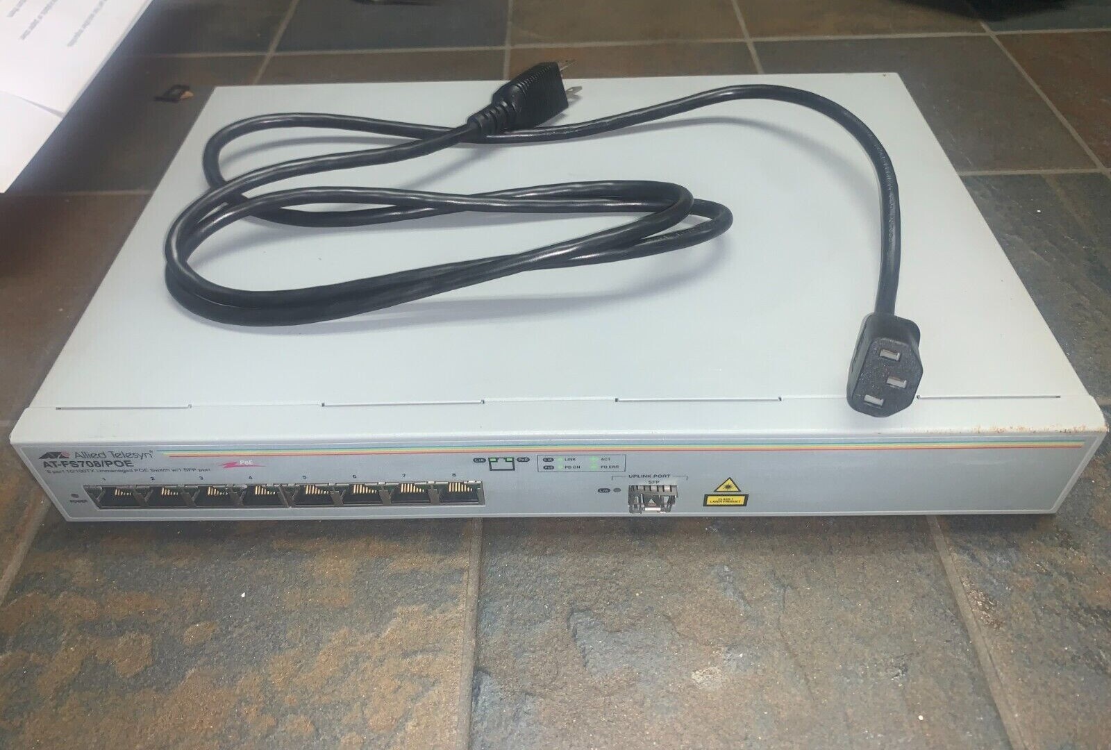 Allied Teselyn AT-FS708/POE ethernet extension with cord sliver-used.