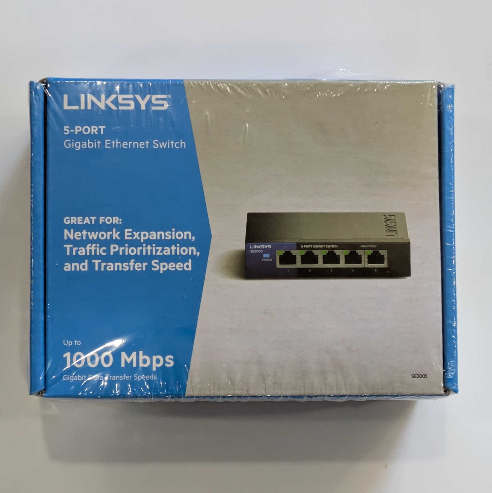 Linksys 5-Port Metal Gigabit Ethernet Network Switch - SE3005. Never opened.