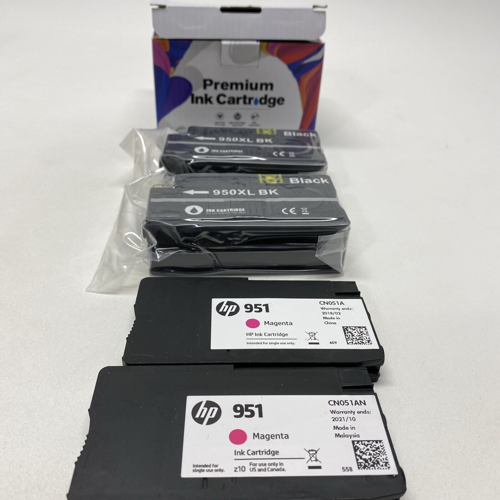Two 950XL Black Sealed and Two Open 951 Magenta color