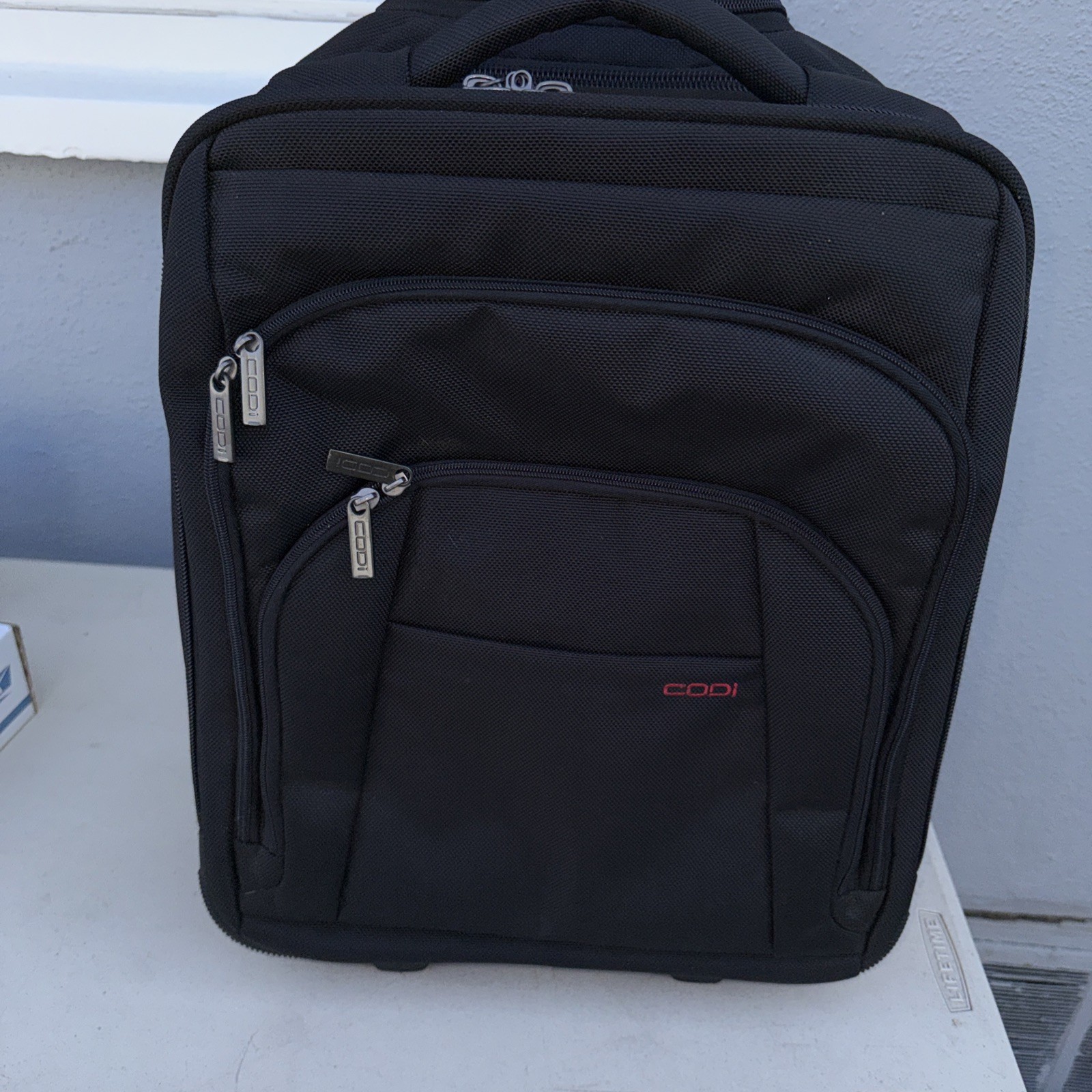 Codi  rolling luggage bag and laptop sleeve
