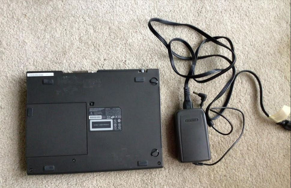 Parts for Compaq Armada 4150 computer, docking station, with power brick