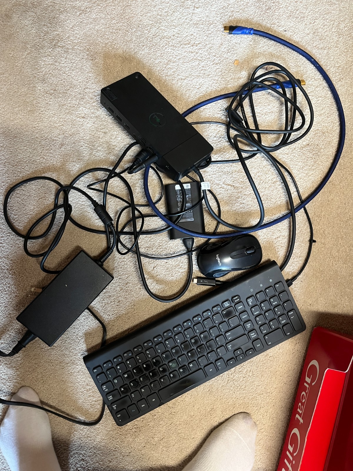 Dell Docking System, Wireless Keyboard, Logitech Mouse, and Various Power Cords