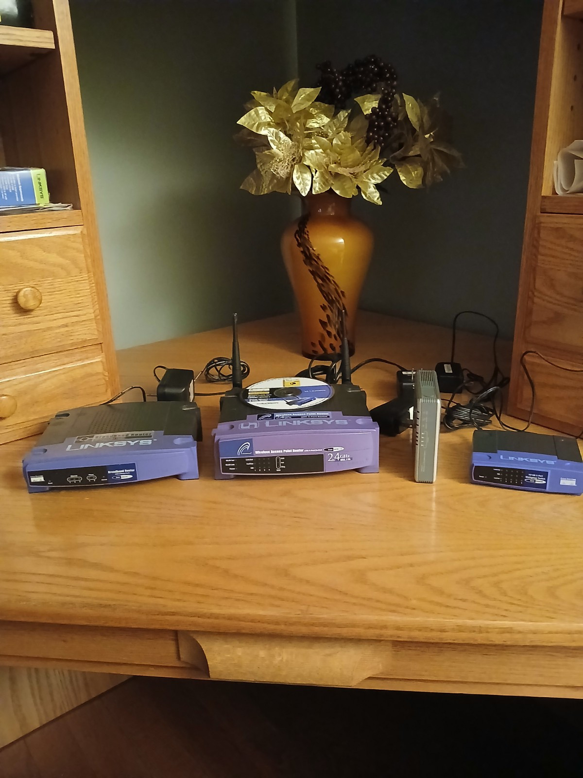 3 Linksys Routers 1 Workgroup Switch
