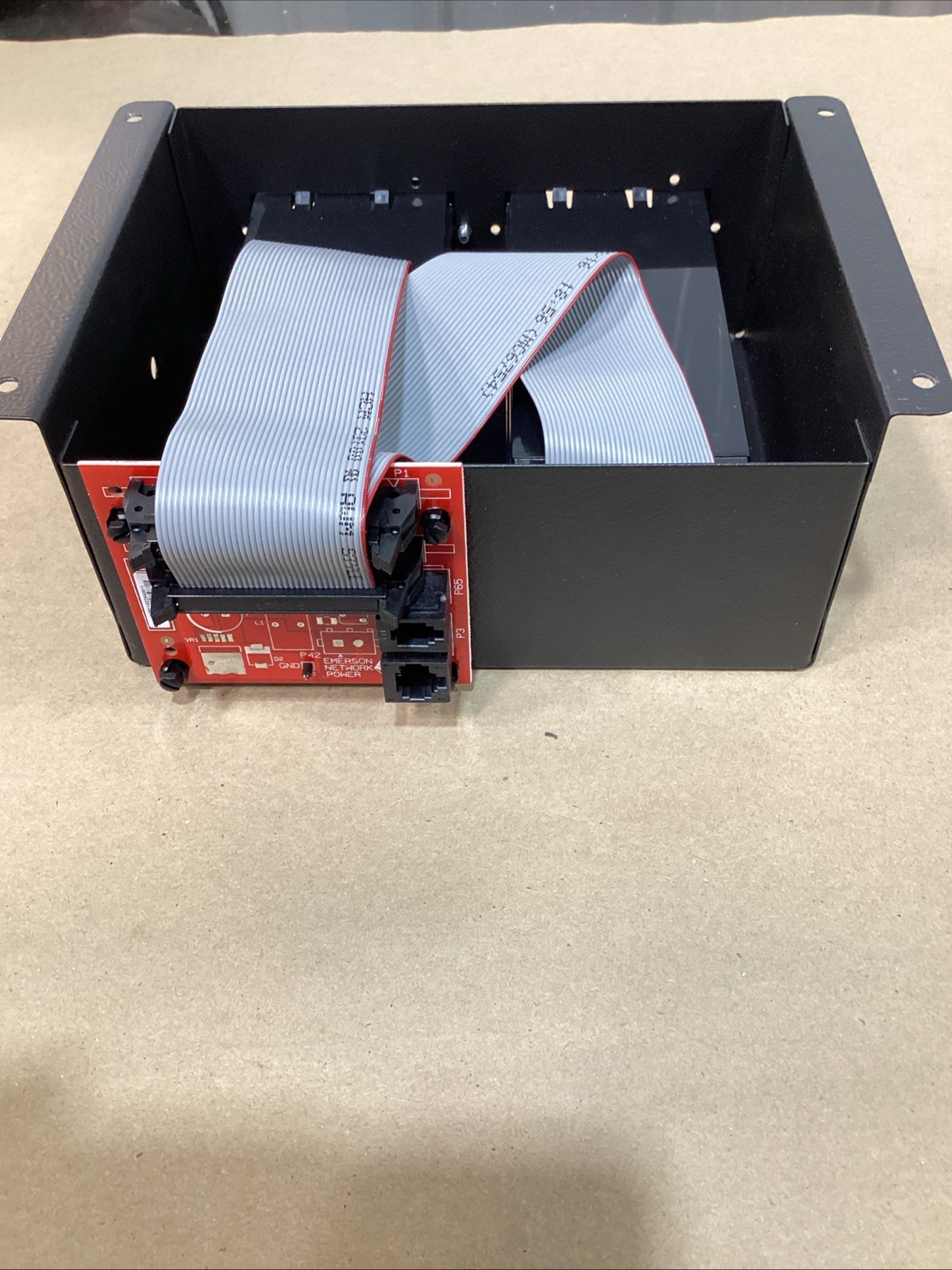 Vertiv IS-UNITY-DP Communications Card 417831G inside of an Emerson Intellislot