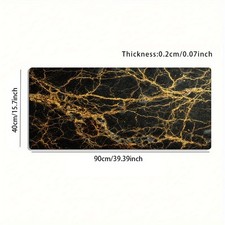A Large Gaming Mouse Pad Featuring a Luxurious Black And Golden Marble Texture picture
