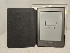 AMAZON KINDLE D01100 6.5”h X 4.5” Reading Tablet W/Charger POWERS ON - FOR PARTS picture