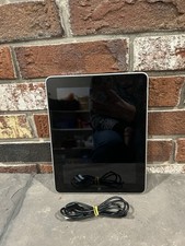 first-generation Apple iPad with a 30-pin charging cable picture